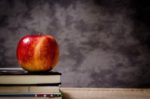 red-apple-on-top-of-books